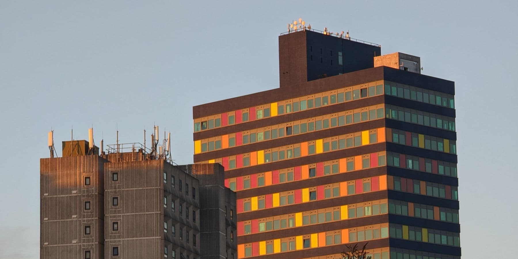 Coloured panels on a Leicester tower block at dusk