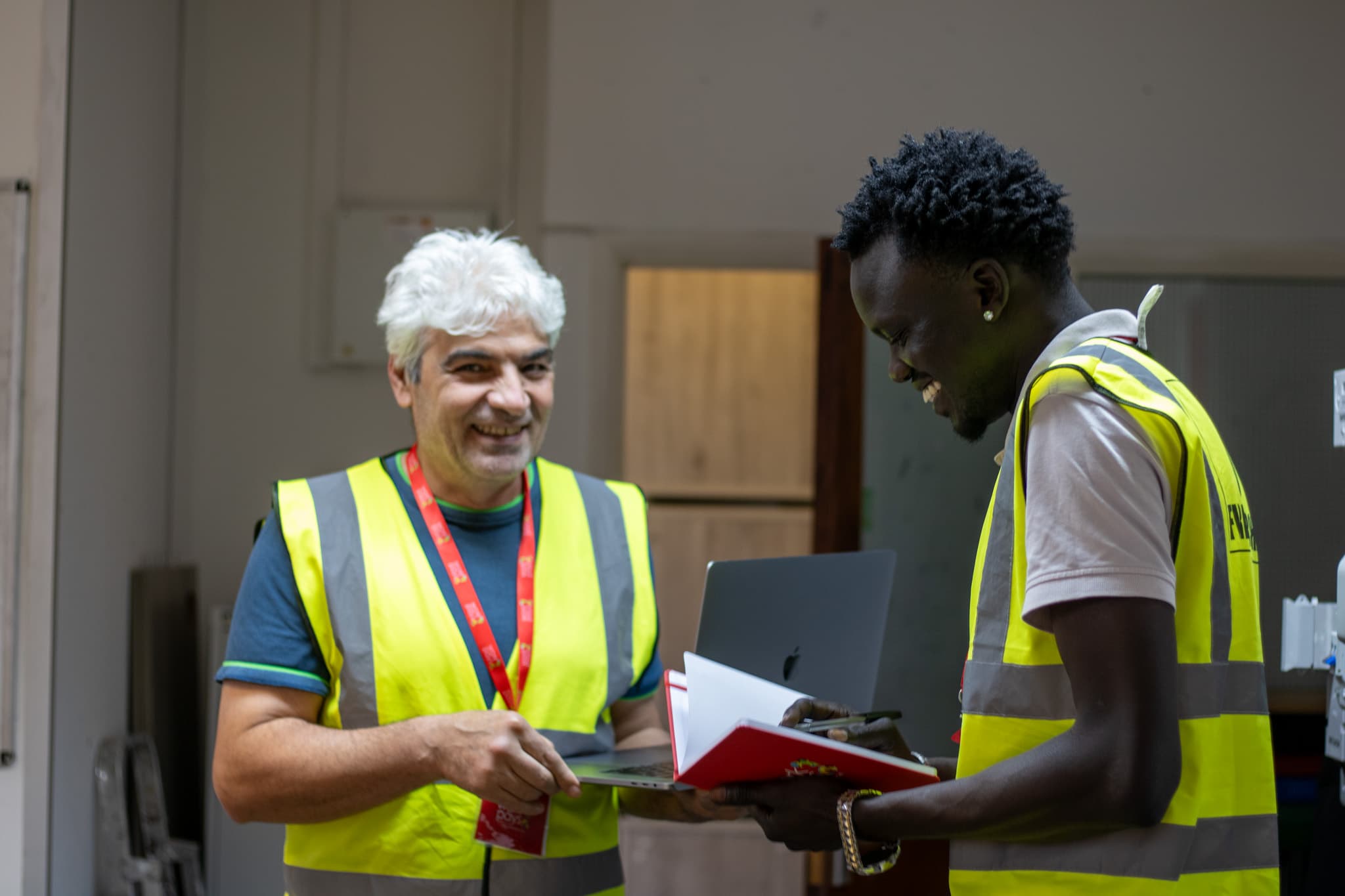 Two learners reviewing notes together during training